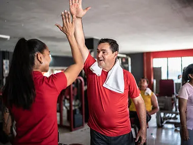 Gym members high fiving